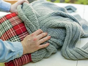 Turn an Old Sweater Into a Chic Preppy Pillow HGTV