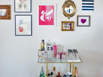 Colorful Gallery Wall Above Bar Cart 