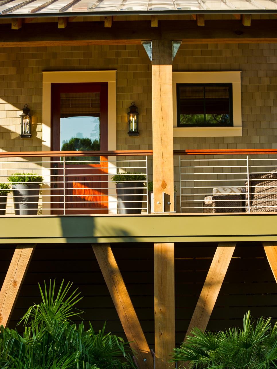 Elevated Front Porch With Rich Mahogany Railing | HGTV