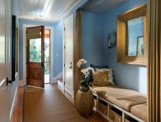Blue Entry Hall Features Sisal Rug and Built-In Bench