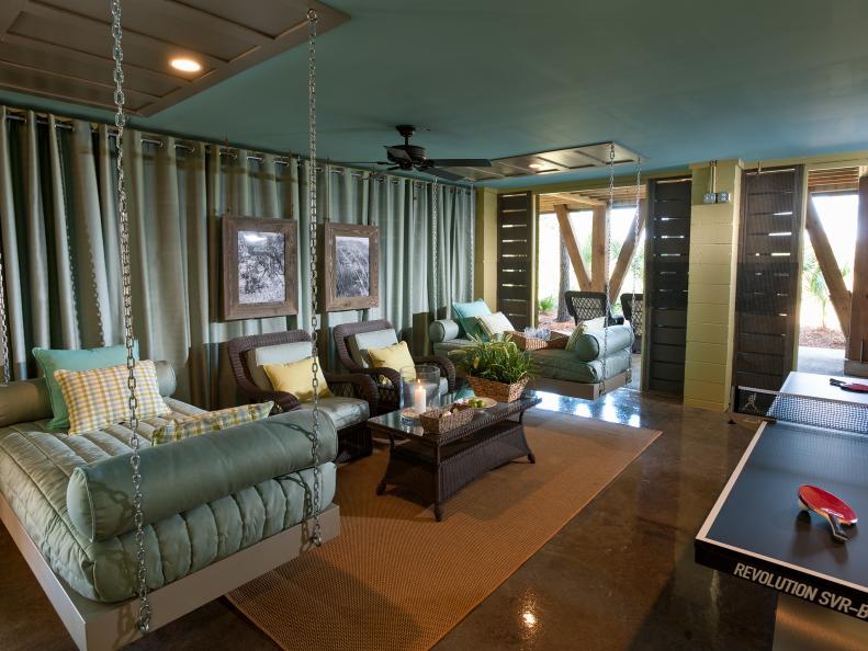 Teal Game Room With Two Hanging Daybeds and Table Tennis