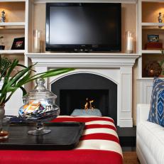 Family Room With White Fireplace Mantel and Buiilt-in Shelves
