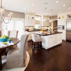 White Romantic Kitchen With Dark Hardwood Flooring