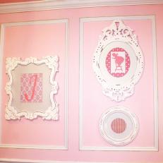 Traditional Pink Nursery Wall With Vintage Picture Frames