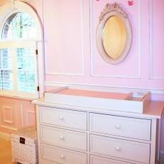 Traditional Pink Nursery With Changing Table Dresser