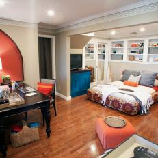 Blue and Orange Bohemian Bedroom With Home Office and Built-in Shelving