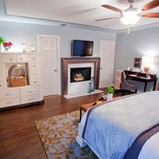 Contemporary Bedroom With Light Blue Walls and White Armoire