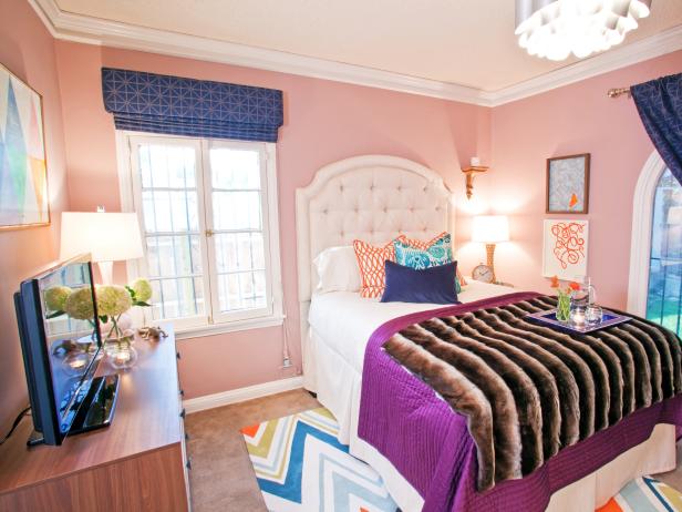 Eclectic Bedroom With Pink Walls And Orange And Blue Accents