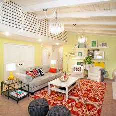 Eclectic Living Room With Yellow Walls and Exposed Beam Ceiling