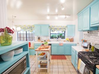 White Kitchen With Blue Cabinets, Small Island, Red Rug