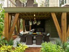 The ground-level gathering area accommodates both outdoor dining and relaxation.