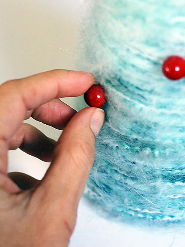 Attaching Red Berry to Light Blue Yarn Christmas Tree