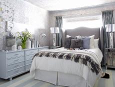 A Contemporary Bedroom With Gray, Blue and Silver Accents
