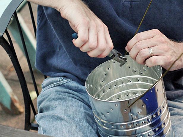Hook the ends through holes in the cans and crimp them into hooks with your pliers. Be sure to make the handles long enough that the heat from the candles doesn't burn little hands.