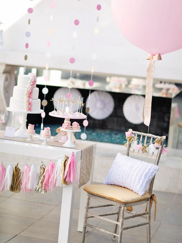 Cake Table With Tassel Garland, Pink Balloon, Gold Chair