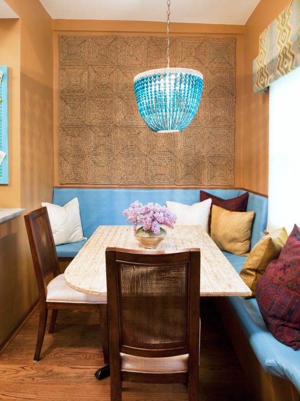 Neutral Dining Nook With Woven Wall Panels and Blue Chandelier