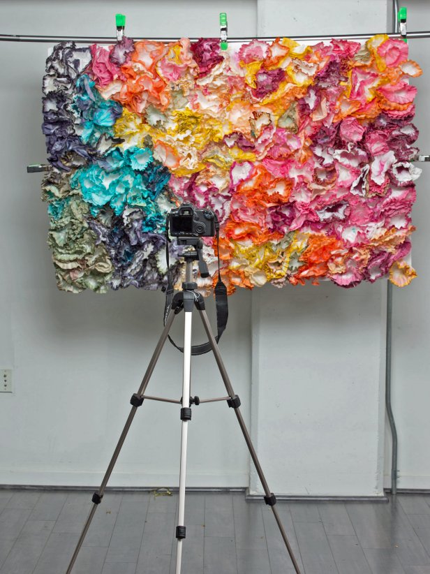 DIY Photo Booth With Tripod, Camera and Colorful Floral Backdrop