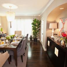 Formal Dining Room With Sleek, Black Buffet
