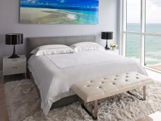 Contemporary Light Gray Bedroom With Ocean Artwork and Ocean View