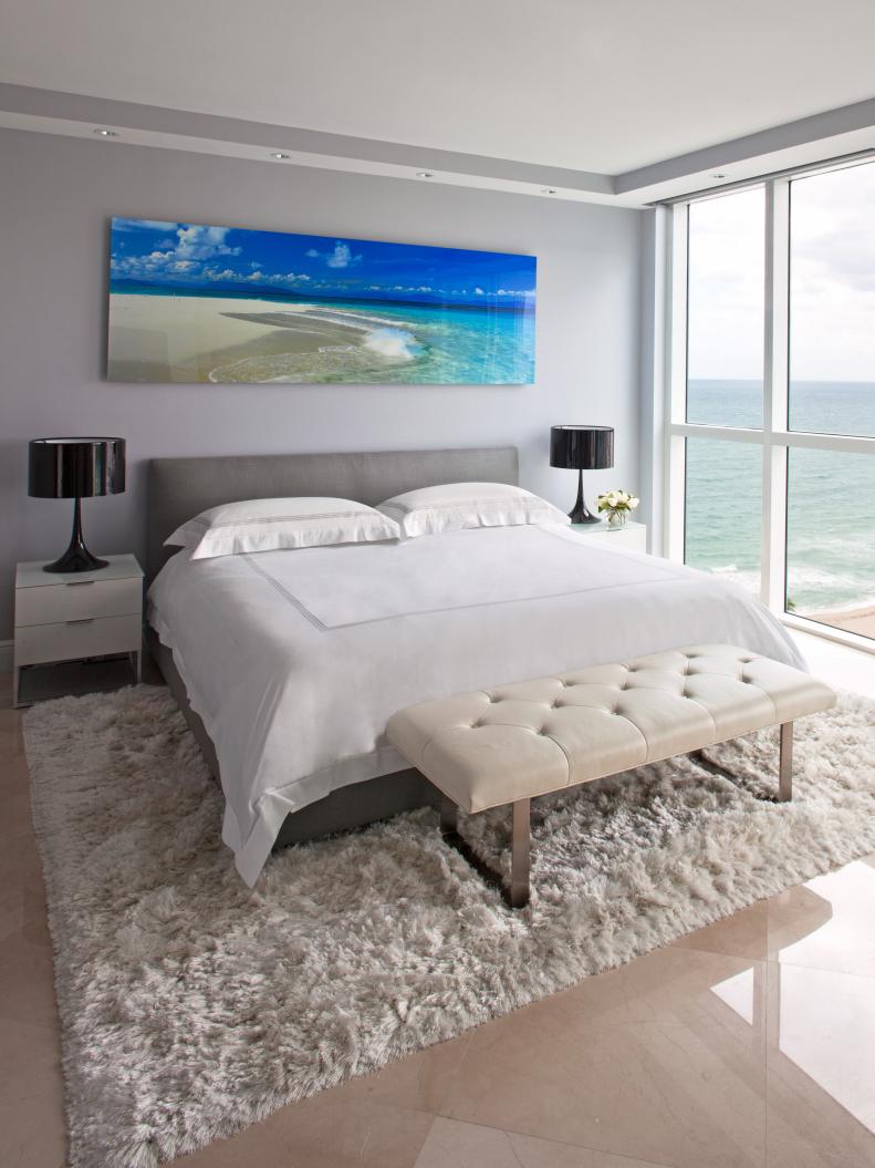 Contemporary Light Gray Bedroom With Ocean Artwork and Ocean View