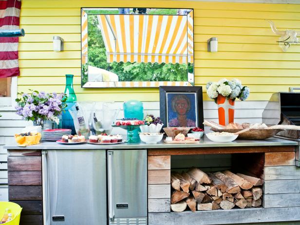 Cottage Patio With Outdoor Grilling Station & Yellow and White Wall