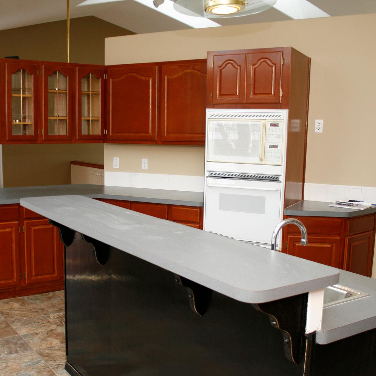 Kitchen in our new house needs updating, considering painting