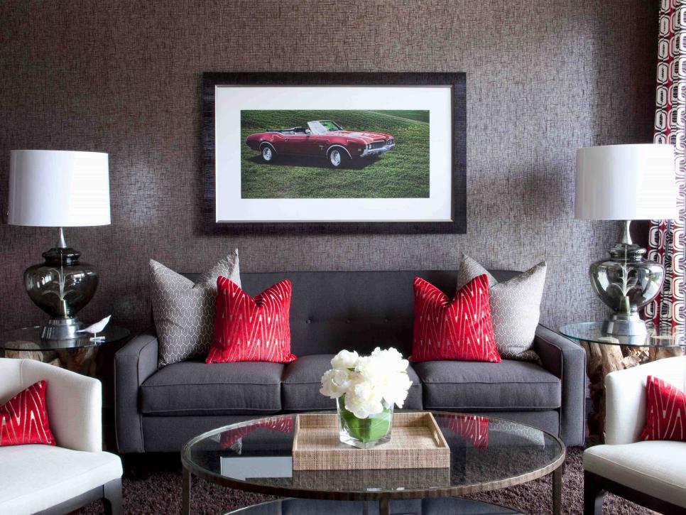 gray sofa with red pillows