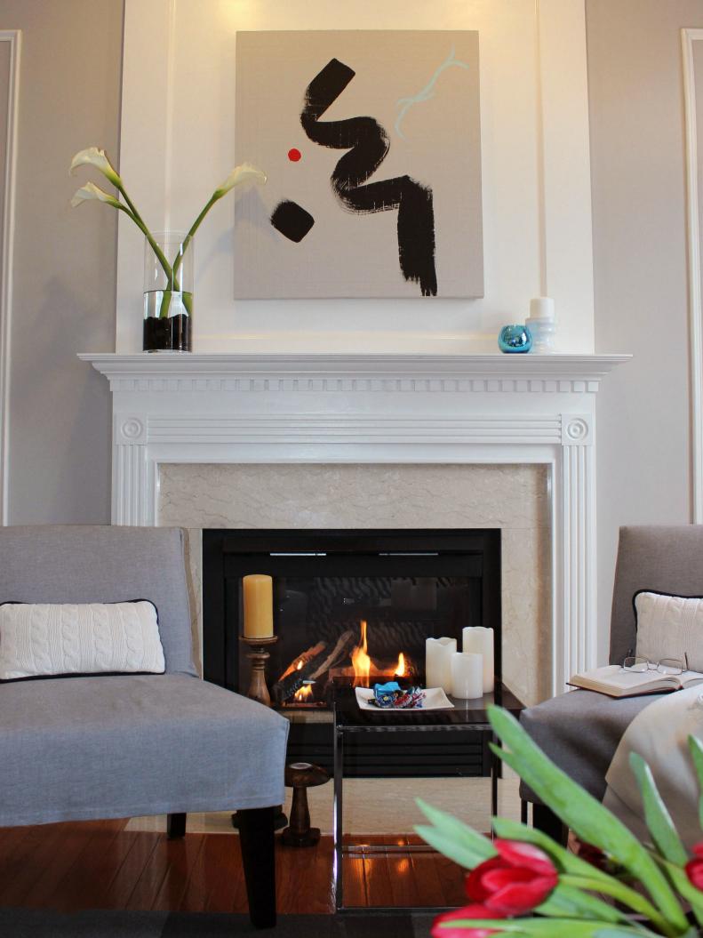 White fireplace with a mantel extended to the ceiling