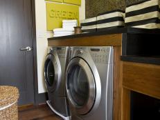 Laundry Room With Stainless Washer and Dryer and Penny Tile