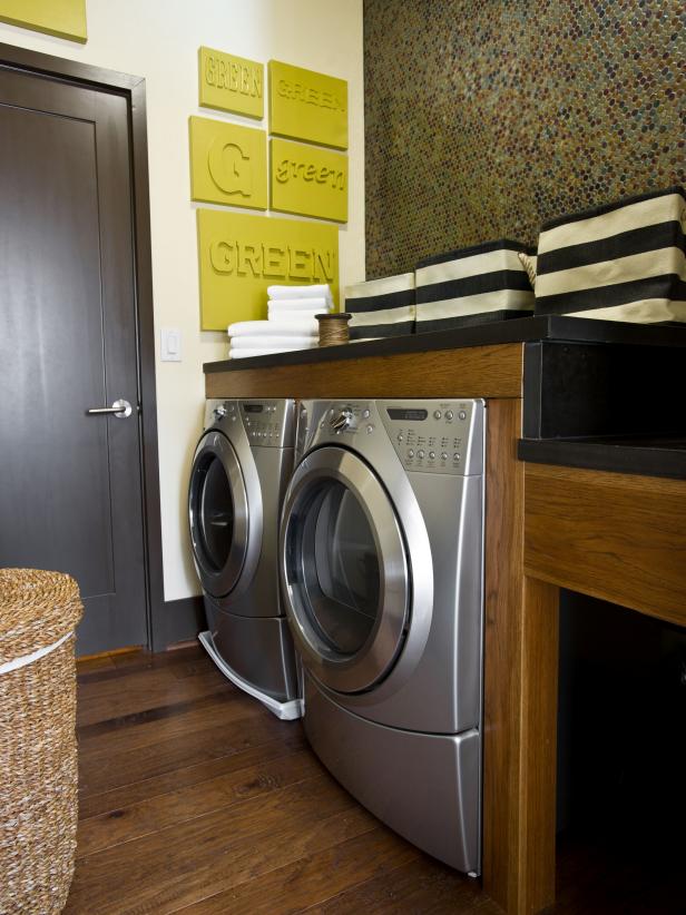 Laundry Room With Stainless Washer and Dryer and Penny Tile