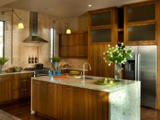 Neutral Kitchen With Wood Cabinets, Stone Countertop, Range Hood