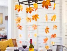 Fall leaves hanging from dining room chandelier