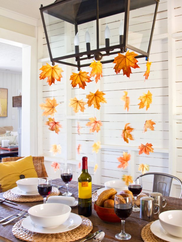 Fall leaves hanging from dining room chandelier