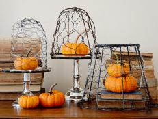A metal lamp frame and chicken wire are repurposed for this simple project that can be decorated for all seasons. Paint them black and add artificial spiders to create a creepy cobweb effect that is perfect for Halloween.