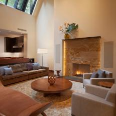 Modern Living Room With Stone Fireplace and High Ceiling