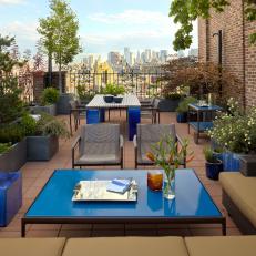 Urban Rooftop Lounge with Bright Blue Accent Furniture