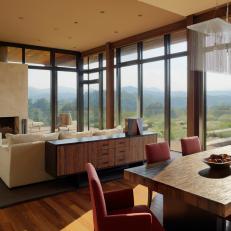 Living Room With Glass Walls and Mountain Views