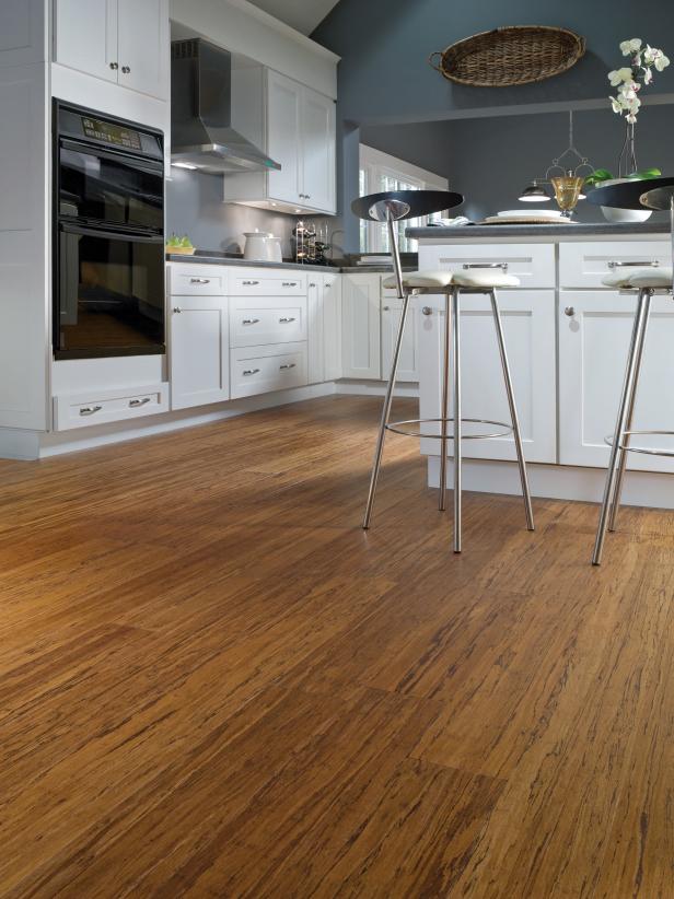 Kitchen With Blue Walls, White Cabinets and Bamboo Flooring