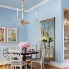 Blue Eclectic Dining Room With Oversized Chandelier