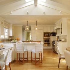 Spacious White Kitchen With Vaulted Ceiling