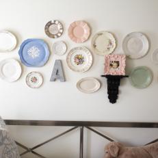 White Bedroom Wall Displays Colorful Plate Decorations and Photo Shelf