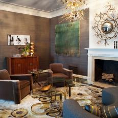 Gold and Gray Living Room With Unique Light Fixture
