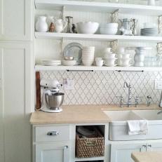 White Cottage Style Kitchen With Open Shelving and a Farmhouse Sink
