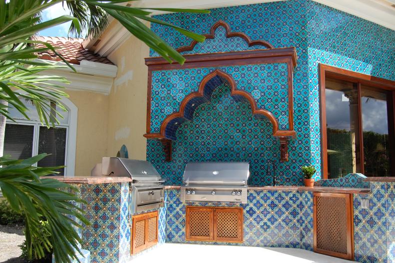 Outdoor Kitchen with Blue Spanish Tiles and Stainless Steel Grills