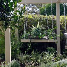 Lush Green Garden With Large Hanging Planter