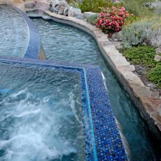 Infinity Pool With Mosaic Tile & Stone Border