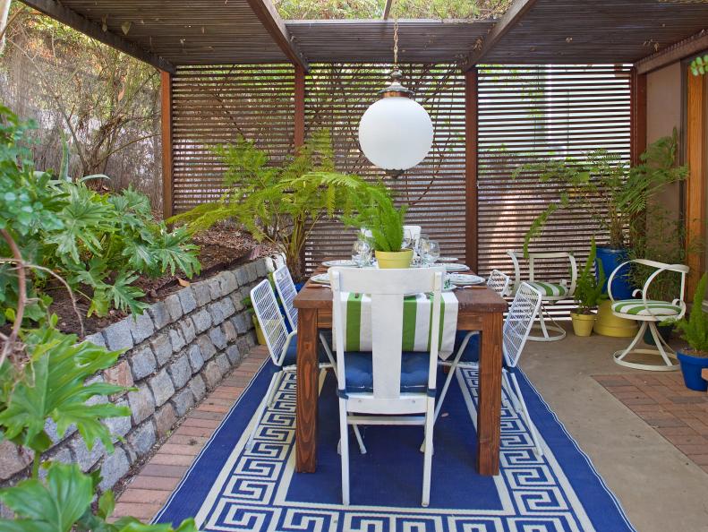 Outdoor Dining Room With Blue Area Rug