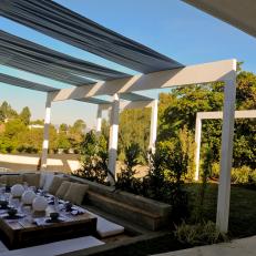 Retractable Shades in the Outdoor Area Provide Relief from Summer Sun 