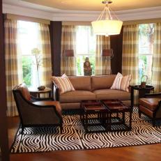 Brown Living Room with Zebra Rug and Plaid Window Treatments