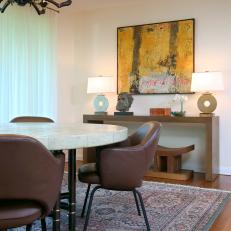 Eclectic Dining Room With Leather Chairs and Oriental Rug